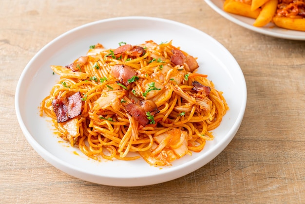 Stirfried spaghetti with kimchi and bacon