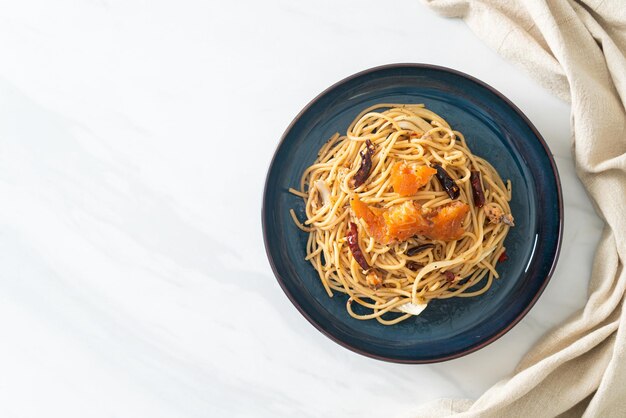 stirfried spaghetti with salmon and dried chilli fusion food style