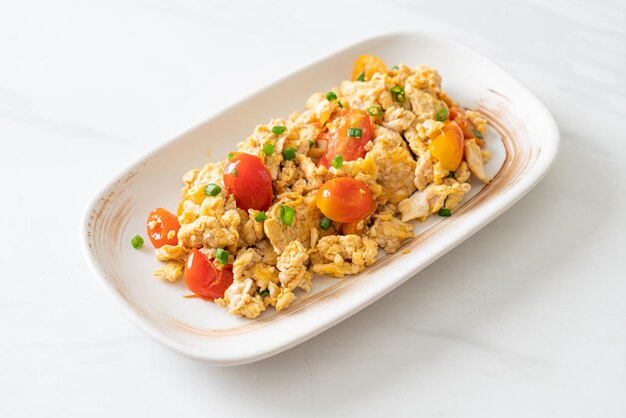 Stirfried tomatoes with egg on plate