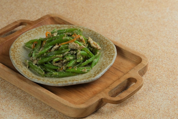 Stirfry beans on brown background