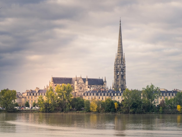 StMichel cathedral with its bell tower at the foot of the Garonne river in Bordeaux France