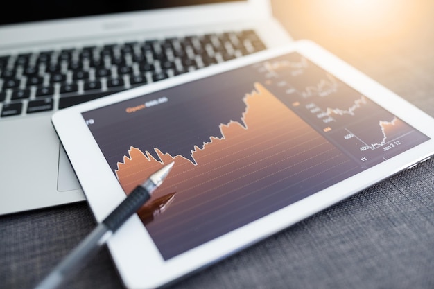 Photo stock exchange diagram on digital tablet