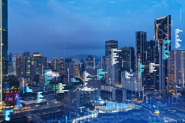 Stock market graph hologram night panorama city view of Kuala Lumpur KL is popular location to gain financial education in Malaysia Asia The concept of international research Double exposure