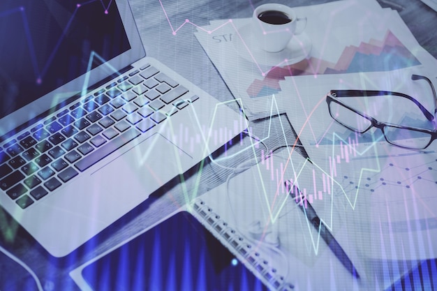Stock market graph and table with computer background Double exposure Concept of financial analysis