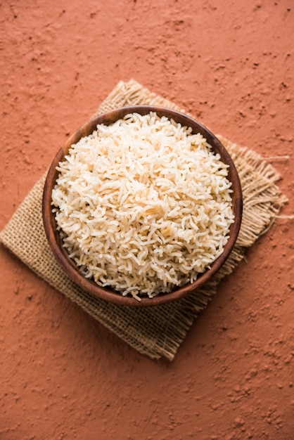 Stock photo of cooked brown basmati rice served in a bowl, selective focus