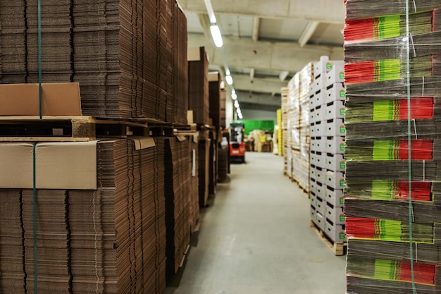 Stocks of unpacked cardboard boxes in storage of raw material