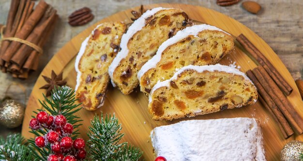 Stollen Christmas cake on the table. Selective focus. Food.