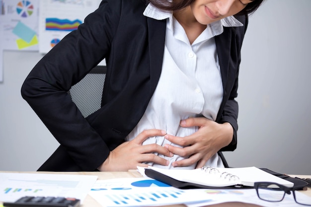 Photo stomach ache symptom of irritable bowel syndrome, chronic diarrhea