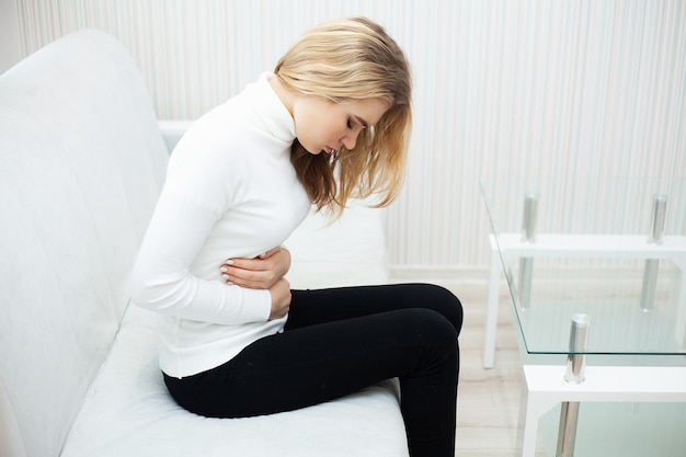Stomach pain, Woman having painful stomachache,Female suffering from abdominal pain