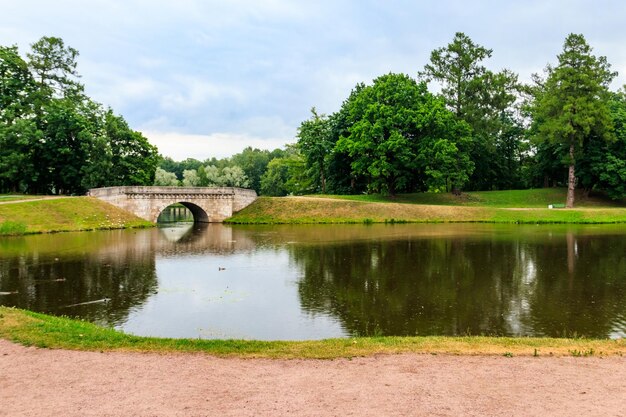 Stone arch bridge across a lake in Gatchina Russia