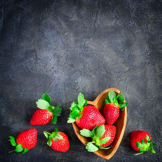 Stone background with ripe strawberries.