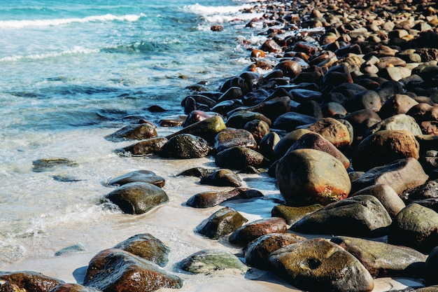 Photo stone on beach with background.