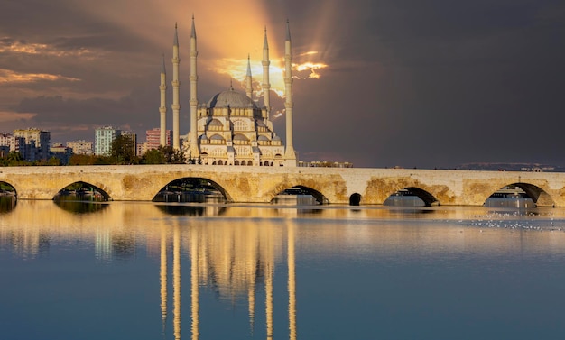 Stone bridge Takpr in Turkish and the main mosque in Adana Turkey