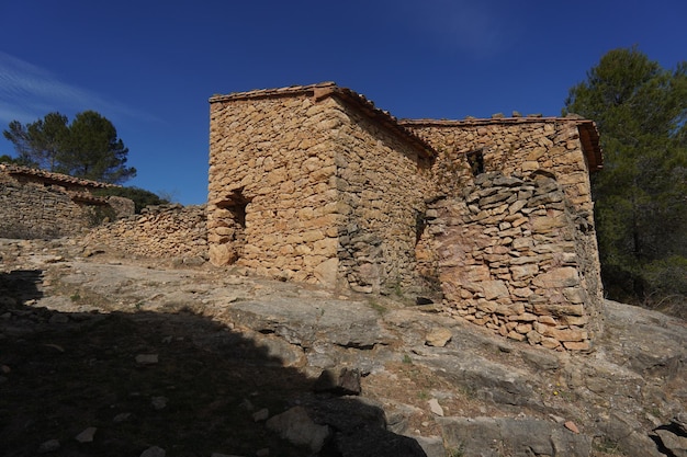 A stone building with a blue sky in the background