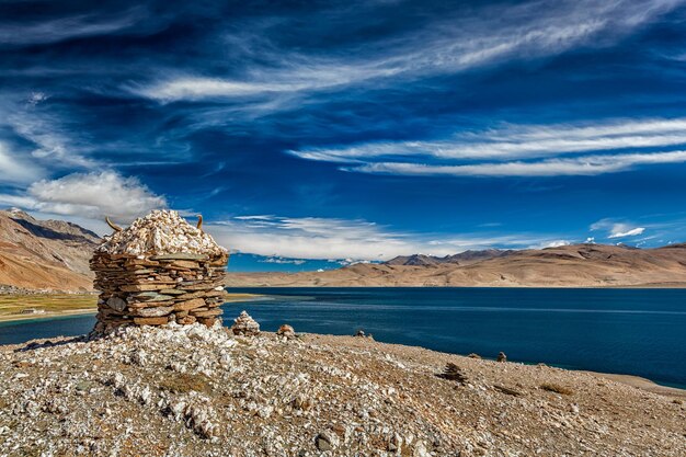 Stone cairn at Himalayan lake Tso Moriri Korzok Changthang area Ladakh Jammu and Kashmir India