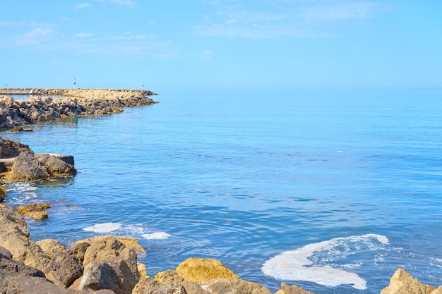 The stone coast of northern Crete on a sunny day.