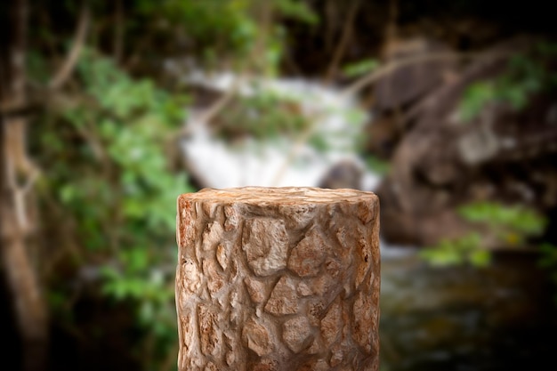 Stone empty podium product for cosmetic display with defocused nature background