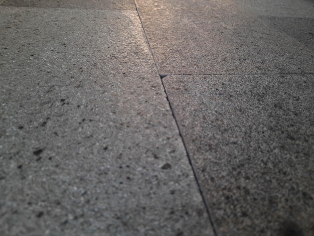 A stone floor with a blue light on it