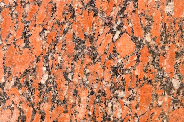 Stone granite with black white and red spots texture background