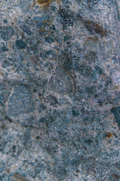Stone grayblue textured background natural stone the black\
background is a blank for the design uneven surface