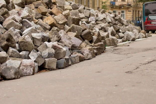 Stone of grey blocks lying in the road