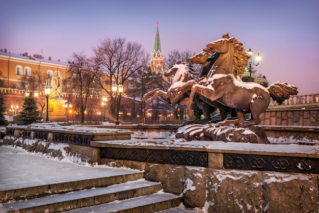 Stone horses rushing gallop in Alexandrovsky Garden in Moscow  in a snowy morning