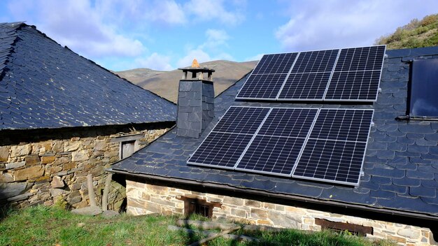 Stone house with solar panels. Rural