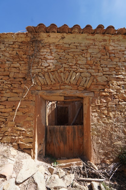 A stone house with a window that says'the word " on it