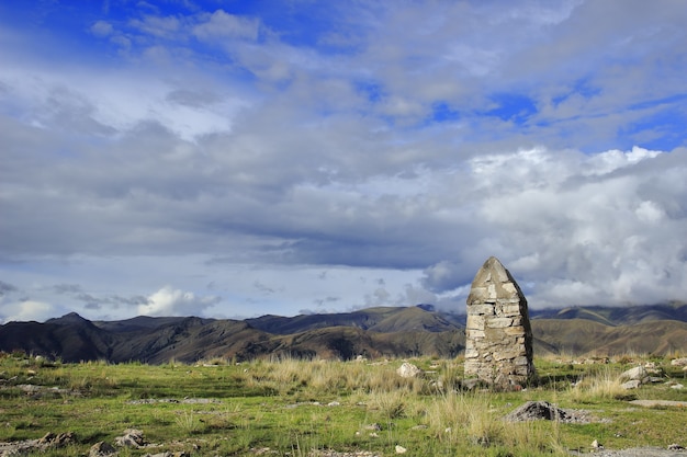 Stone landmark in the mountains of central andean