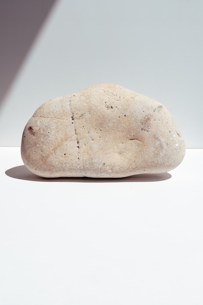 Stone podium with dried flowers to display products or cosmetics Ecological trends Place for text