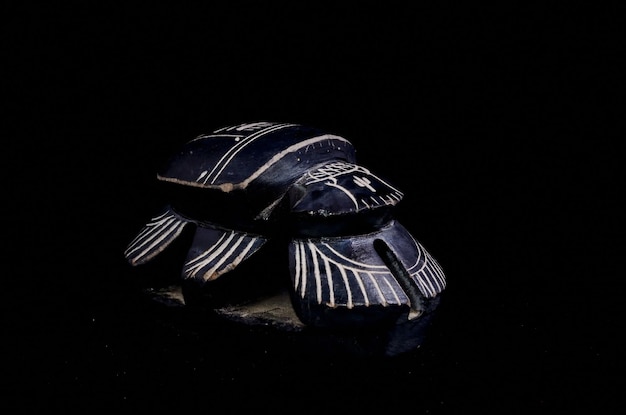 Stone Ritual Egyptian Scarab isolated on Black Background