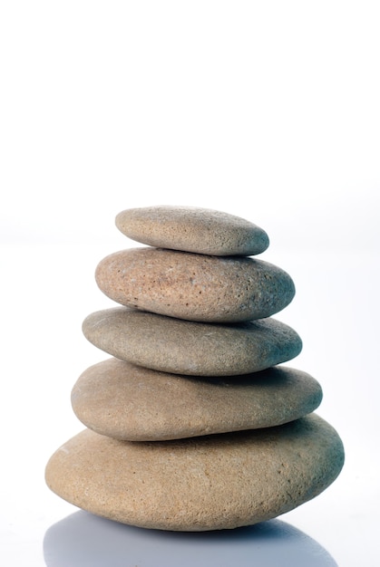 Stone's pyramid from five objects isolated on white background