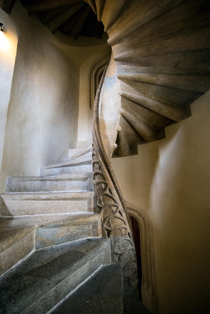 Stone spiral staircase in an old building in Austria.