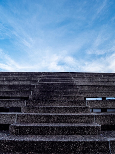 Stone stair in the way up to blue sky