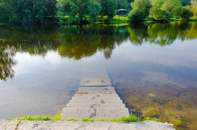 A stone staircase leading to the water of the lake.