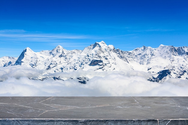 Stone table top and snow mountain background - can used for display or montage your products.