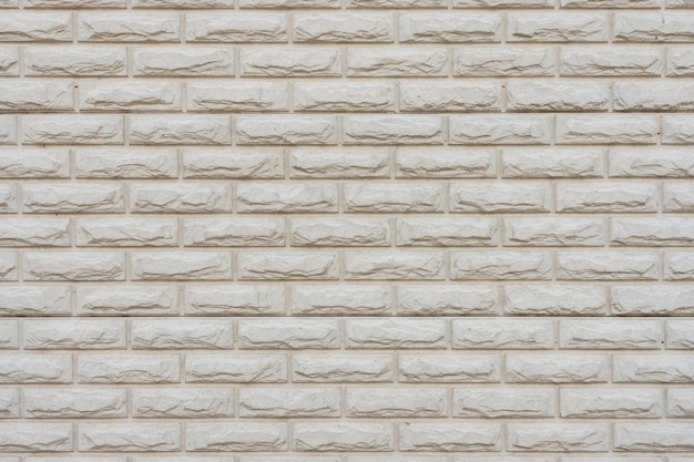 Stone wall carving old white brick pattern background