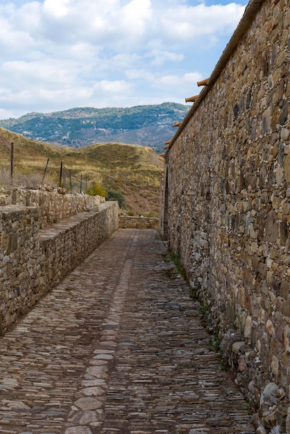 Stone wall of the old castle in perspective