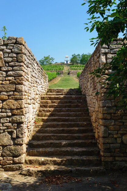 Stone wall of old ruin building against sky