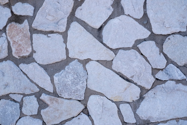 Stone wall texture. Decorative wall with mosaic stones.