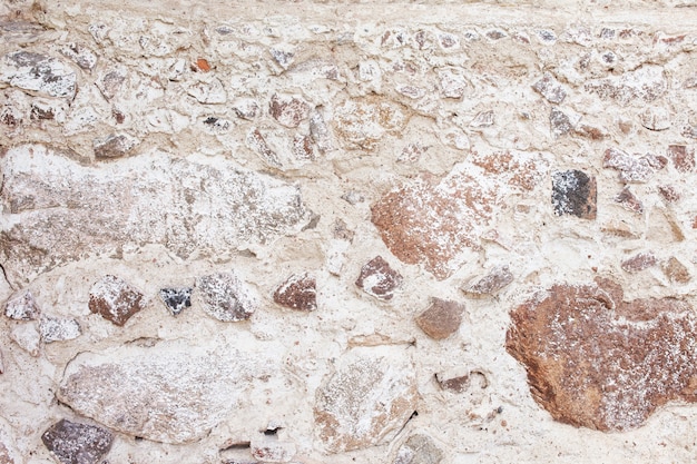 Foto trama di muro di pietra. parete decorativa delle rocce del mosaico