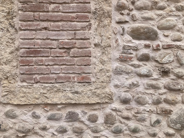 A stone wall with a brick wall and a window that says " do not enter ".