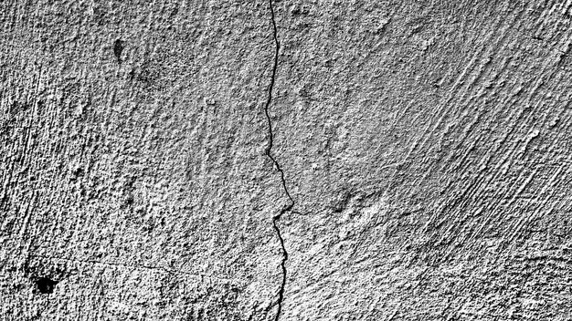 Stone wall with a crack. black and white texture for design