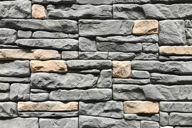 Muro di pietra con un colore grigio. fondo e struttura di interior design di concetto