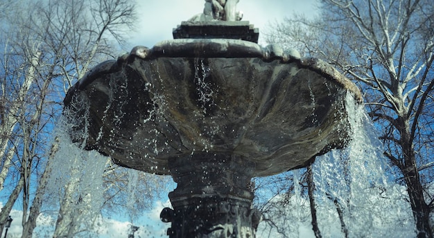 Stone, water fountains with mythological sculptures in the gardens of the Palace of Aranjuez in Spain