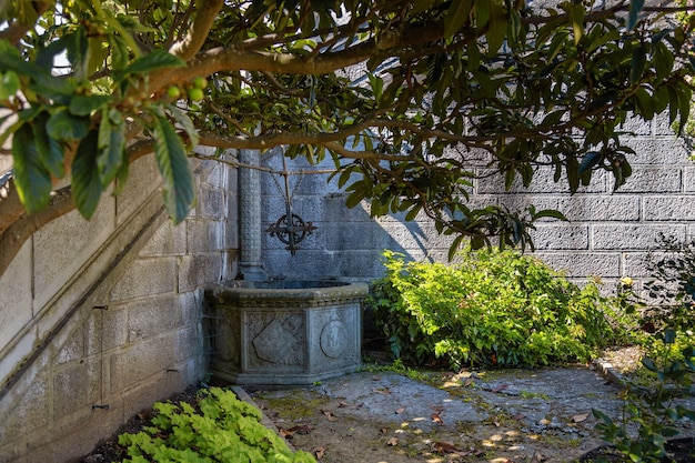 Stone well in beautiful landscape park of the Livadia Palace on the Black Sea coast Yalta Crimea