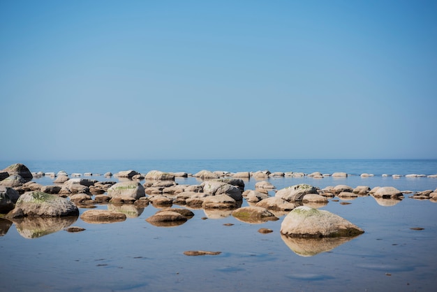 Stones balance on the beach. Place on Latvian coasts called Veczemju klintis