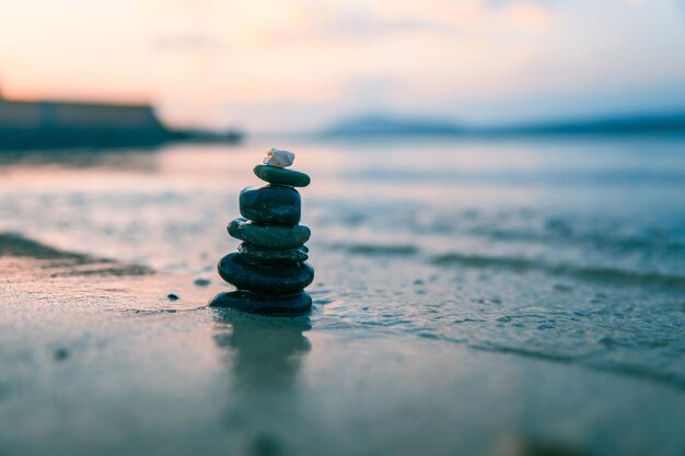 Stones Balance in sunrise at sea