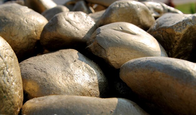 Stones covered with gold paint background image