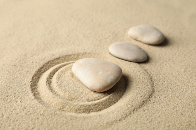 Stones on the sand with patterns. Zen concept